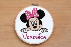 a cross stitch minnie mouse with the word veranca on it's face