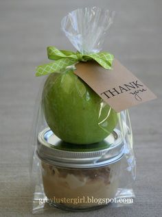 an apple in a jar with a thank you tag on it