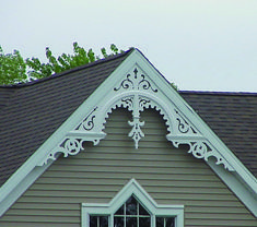 an ornate window on the side of a house