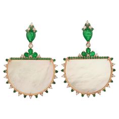 Cast from 14-karat gold, these stunning earrings are hand set with 3.67 carats Emerald, 23.12 carats mother of pearl and .54 carats of glimmering diamonds. FOLLOW MEGHNA JEWELS storefront to view the latest collection & exclusive pieces. Meghna Jewels is proudly rated as a Top Seller on 1stDibs with 5 star customer reviews. All items manufactured by us are handmade and can be customized or redesigned. Composition Size - 41X34 MM Gold Weight - 13.009 gm Gemstone - Mop (23.12 Ct), Emerald (3.67 Ct Mother Pearl, Stunning Earrings, Emerald Diamond, Mother Of Pearl, Gemstone Earrings, Emerald, Gold Earrings, Jewelry Earrings Dangle, Dangle Earrings