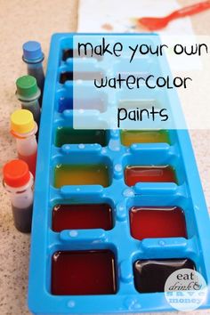 an ice tray filled with watercolor paints and the words make your own watercolor paints