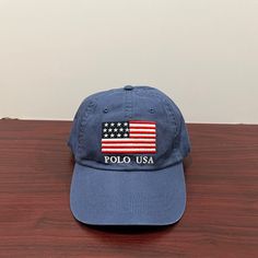 Brand - Ralph Lauren Polo Hat Type - Dad Hat Color - Blue Condition- Brand New Gender - Unisex Usa Flag Classic Blue Cap Hat, Blue Cotton Hat With Short Brim, Classic Blue Baseball Cap One Size, Classic Blue Baseball Cap For Summer, Patriotic Blue Baseball Cap With Curved Brim, Blue Patriotic Adjustable Baseball Cap, Adjustable Patriotic Blue Baseball Cap, Blue Cotton Flat Brim Baseball Cap, Patriotic Blue Beach Hat