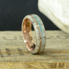 "Specifications: - 2mm Antler - .75mm Rose Gold - 1.25mm Crushed Larimar - 2mm Antler The total width of this ring is 6mm, Comfort Fit The Rose Gold pinstripe will always stay the same, unless you choose one of the gold options. Then the whole ring will match the gold option you choose. - METAL COLOR: Choosing a different metal may change the color of all the metal pictured (unless otherwise specified above). We don't plate the metal to give it a different color. (See metal option picture as a r Antler Rings Women, Ring Chart, Elk Antler, Antler Ring, Design Your Own Ring, Elk Antlers, Larimar Stone, Hand Made Jewelry, The Rose