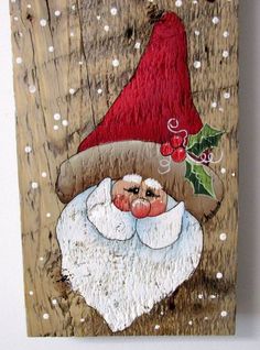 an image of a santa clause painting on wood