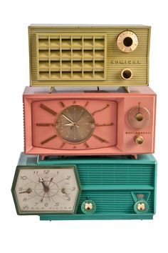 an old fashioned radio sitting on top of each other