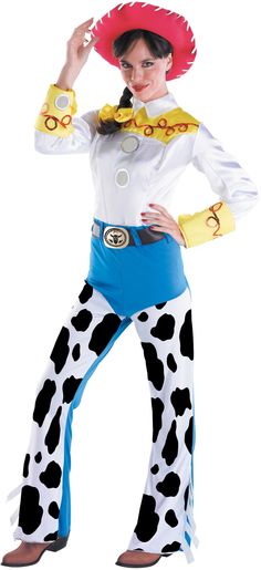 a woman in a cowgirl costume is posing for the camera with her hands on her hips