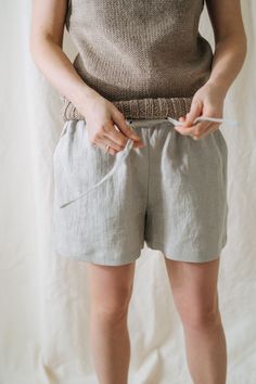 "Lilac shorts, Linen shorts, Bride shorts, Linen clothing, Beige shorts, Summer shorts, Beach linen shorts, Women linen shorts, City shorts -----------We do make custom made clothes. Just let us know your measurements ------------------- * Name: Lilac shorts * Handmade * Colour: NATURAL * 100 % washed & softened Lithuanian linen * 205 g/m2 * Pockets * Belt * Length of the shorts - 36 cm The model is 178 cm height and is wearing size S. Choose your size (your body measurements) : Size XS: US Beach Linen Pajama Shorts, Beach Linen Shorts With Short Legs, Linen Pajama Shorts For Summer, Bermuda Linen Shorts For Beach, Relaxed Fit Linen Shorts, Bermuda Linen Shorts With Elastic Waistband, Summer Linen Pajama Shorts, Vacation Linen Shorts With Short Inseam, Vacation Linen Shorts With Short Leg