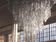 a large chandelier hanging from the ceiling in a building