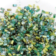 a pile of green and yellow glass beads Teal Eyes, Ziploc Bag, Tila Beads, Bracelet Size Chart, Bead Sizes, Dark Magenta, Large Bracelet, Green Shades, Buy Bead