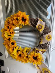 a sunflower wreath is hanging on the front door