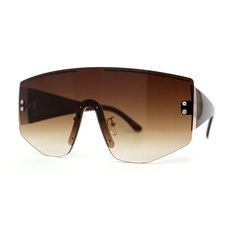 These sunglasses feature a rimless design with a metal frame with thick temples. The luxurious oversize silhouette makes it the ideal everyday pair of sunglasses. Made with a metal based frame, English style nose pieces, metal hinges, and a polycarbonate UV400 protected lens. (a907) Lens Width: 65mm Bridge Width: 22mm Temple Length: 147mm Lens Height: 64mm Size: 5 5/8" (143mm) x 2 1/2" (65mm).  Color: Brown.  Gender: female.  Age Group: adult. Metal Hinges, Rimless Sunglasses, Shield Sunglasses, English Style, Gold Sunglasses, Retro Sunglasses, Oversized Silhouette, Military Fashion, Aviator Sunglasses