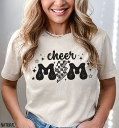 This retro Cheer Mom shirt is a must-have for any proud cheerleader mama! It features a stylish design and comfortable fit, perfect for showing support at games and cheer competitions. This trendy cheer mama tee would make a great gift for any cheer mom to wear with pride!  ♡STYLE Say hello to your new favorite t-shirt! All of our shirts are made with the highest quality materials and are super soft and cozy! Bella and Canvas Brand Shirts Solid Colors are 100% Cotton Heather Colors are 52% cotto Retro White Tops For Mother's Day, Retro Cotton Tops For Mother's Day, All Star Cheer Mom Shirt Ideas, Vintage Short Sleeve Tops For Mother's Day, Mother's Day Vintage Short Sleeve Tops, Retro Cheer Shirt, Cheer Mom Era Shirt, Vintage Short Sleeve T-shirt For Mother's Day, Cheerleading Mom Shirts