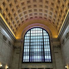 the inside of a train station with a large window