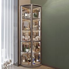 a curved display case with many bottles and wine glasses in it's glass doors