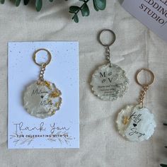 two personalized key chains and a thank you card