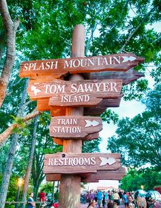 several wooden signs pointing in different directions