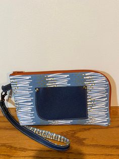 "Canvas Wristlet, Noodlehead Yarrow pattern. Lined inside with card slots, coin zipper, and slip pocket. Faux leather accent pocket and strap. Orange zipper.  Just the right size for errands or slipping into a tote or backpack.  Interfaced for structure, durable. Measures: 9\" wide, 5\" tall, 1 inch thick." Crossbody Wristlet With Zipper For Daily Use, Daily Use Crossbody Wristlet With Zipper Closure, Daily Crossbody Wristlet With Zipper Closure, Travel Crossbody Wristlet With Zipper Closure, Crossbody Wristlet With Zipper For Travel, Travel Wristlet With Zipper Closure And Crossbody Shape, Wristlet Purse, Purse Wallet, Purses And Handbags