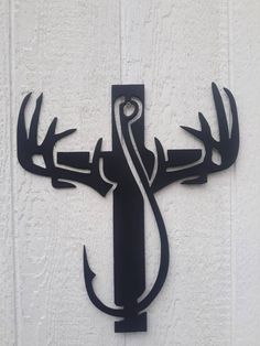 a metal deer head mounted to the side of a building