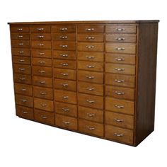 a large wooden cabinet with many drawers