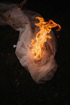 a piece of plastic wrapped around fire on the ground