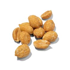 almonds on a white surface with one peeled and the other unwrapped