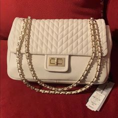 Authentic Large Leather Karl Lagerfeld Quitled Cream Chain (Gold) Shoulder Bag, Never Worn Out, Took Tags Off To Wear For An Outing But Decided Not To Go, Has Rear Snap Closure Compartment, Front Has Gold Turnlock Entry/Exit, Has A Zippered Compartment & 2 Split Pockets In Bag, No Feet On Bottom Of Bag, Will Come With Tags Shown In Pic, Purchased From Neiman Marcus, Very Beautiful Bag Approximately 8 H Inches X 13 W Cream Shoulder Bag, Luxury White Flap Bag With Chain Strap, Luxury Shoulder Bag With Chain For Shopping, White Formal Flap Bag With Chain Strap, Formal White Flap Bag With Chain Strap, Classic White Bag With Chain, White Flap Shoulder Bag With Chain Strap, White Chic Flap Bag With Chain Strap, Chic White Flap Bag With Chain Strap