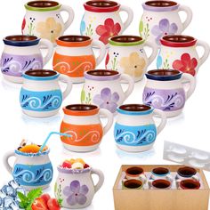 a variety of ceramic teapots and cups with different designs on them, including strawberries