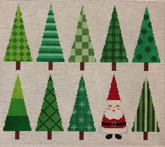 a cross stitch pattern with christmas trees and santa