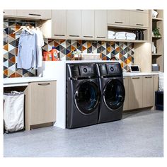 a washer and dryer sitting in a kitchen