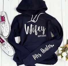 a hoodie with the words wife and mr and mrs on it next to sneakers