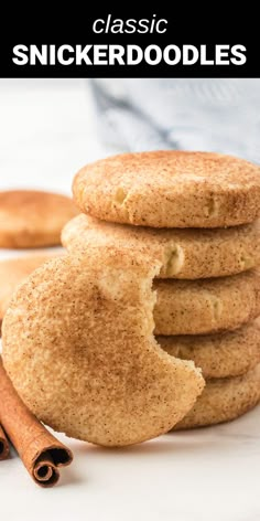 cinnamon sugar cookies stacked on top of each other with cinnamon sticks in the foreground