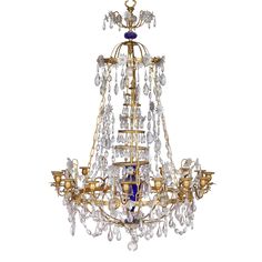 an ornate chandelier with blue glass and gold trimmings on the bottom