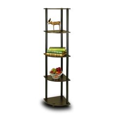 three tiered shelving unit with bookshelf and bowl of fruit