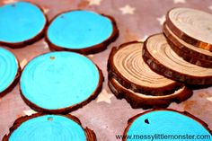 several pieces of wood with blue paint sitting on top of each other in front of stars