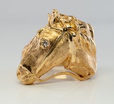 Horse Jewelry, 14K Gold Horse Ring, Equestrian Ring, Gold Ring, Horse Head Ring, Natural Diamond Ring, April Birthstone, Vintage Ring, Animal Ring, Unusual Ring, Estate Ring. This terrific Vintage ring crafted in highly desirable solid 14K yellow gold. This piece is very finely detailed! One white and fiery .03ct genuine diamond in the eye is SI1 clarity and G color. The presentation measures 24mm (1 inch) tall and is elevated 9mm from your finger. The ring weighs a very substantial 18.4 grams o Horse Rings, Elegant Gold Jewelry With Horse Design, 14k Yellow Gold Jewelry With Horse Design, Equestrian Ring, Gold Horse Design Pendant Necklace, Horse Ring, Gold Horse, Estate Rings, Head Ring