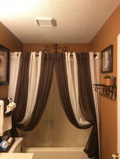 a bath room with a toilet and a bath tub