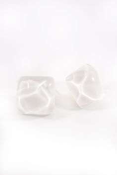 The Elisa Square Earring combines a chunky acrylic square and a snowy mint color for a fresh, modern and clean look. Add energy and interest to your outfits with this beautiful accessory that will help you feel your best. While the square design appears simple, the cut and color make it a dynamic piece of jewelry. Choose from two different color variations. The fresh mint color option is marbled with touches of white, which helps to create a unique look with cool tones. The all white version of Trendy White Resin Earrings, Modern White Resin Earrings, Modern White Rectangular Earrings, Acrylic Earring, Square Earrings Studs, Square Stud, Mint Color, Square Earrings, Fresh Mint