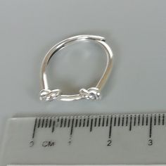 A free size sterling silver ring with knots. SIZE: 1.6 mm x 20 mm as sold ( It can slide wide or narrow and can be adjusted to fit most fingers) WEIGHT: 2.17 gm This ring is made of 925 hypoallergenic sterling silver. Most of my pieces come with a 925 stamp. Can be packaged in a gift box. I can include a personal message from you if needed You are welcome to contact me at... bhavnakwintra1956@gmail.com For more beautiful pieces from my shop, please browse 👇 TOE RINGS: https://www.etsy.com/your/ Knot Ring, Bohemian Earrings, Gift Ring, 925 Silver Jewelry, Rings For Her, 925 Jewelry, Ring Band, Toe Rings, Ear Jewelry