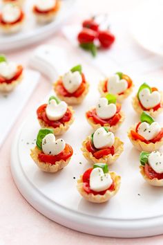 small appetizers are arranged on a white plate