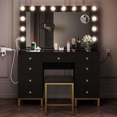 a vanity with lights and a stool in front of it