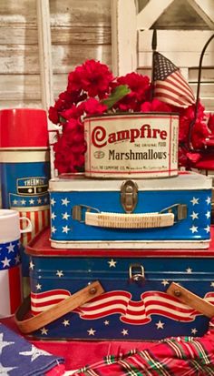 three suitcases stacked on top of each other with red, white and blue decorations