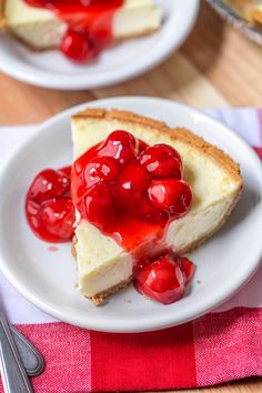 a slice of cheesecake with cherries on top