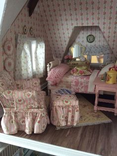 a doll house with furniture and accessories in it's room, including a bed