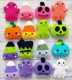 there are many crocheted items that look like halloween characters on the table together