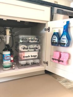 an open refrigerator filled with different types of cleaning products and water filtrators