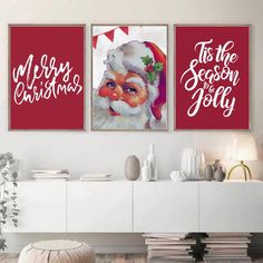 two christmas paintings on the wall in a living room