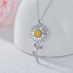 Discover our exquisite Sterling Silver Sunflower Urn Necklace, available in both White Gold and Yellow Gold finishes. Specially designed for women, this elegant jewelry piece offers a heartfelt way to keep cherished memories close to your heart without the need for any stones, blending beauty and sentiment in perfect harmony.Our Sterling Silver Urn Necklace for Ashes boasts a stunning sunflower design, symbolizing adoration and loyalty, making it a meaningful keepsake for women. Available in bot Hair Memorial Jewelry, Crushed Flowers, Urn Bracelet, Sunflower Daisy, Notepaper, Forever In My Heart, Memorial Pendant, Sunflower Jewelry, Urn Necklace