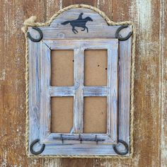 an old window with a horse drawn on it