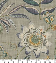 an image of a flower and leaves pattern on grey fabric with white, blue, green, yellow and brown colors