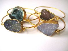 "You want to own one special, gorgeous bangle, this can be one of them in my Bangle series. I love each one of these pieces. It is trendy, original and an eye-catching beauty. You can't go wrong with any of these 22K gold plated bracelets. Price is for one bracelet only. Bracelet (1) Druzy sparkle dark gray----  20mm Bracelet (2) Druzy Taupe/brown sparkle---- 22mm Bracelet 3 is SOLD Bracelet 4 is SOLD   Each stone measures between 20mm to 25mm Lovely color gemstones with gold plated edging The b Gold Plated Bangles, Bridesmaid Bracelet, Gold Plated Bracelets, Grey Stone, 22k Gold, Lovely Colors, Druzy, Dark Gray, Dark Grey